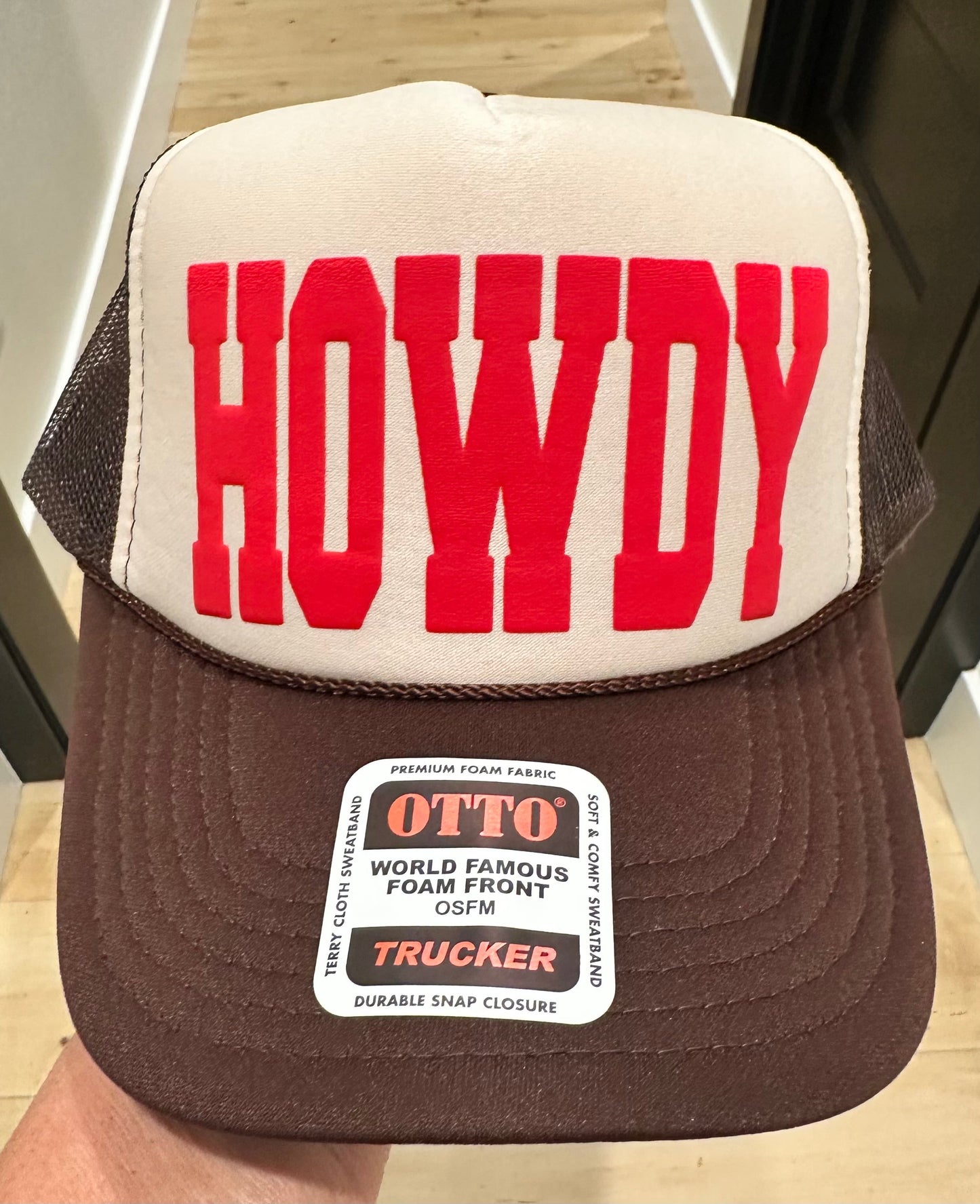 HOWDY in Red puff vinyl on a Brown and Tan Foam Trucker Hat