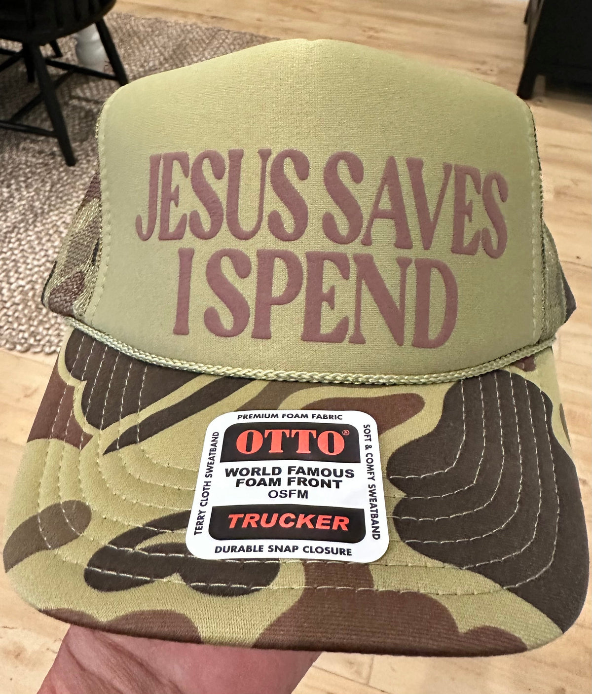 Jesus Saves I Spend in Brown Puff Vinyl on camo and Light Olive Camo Foam Trucker Hat