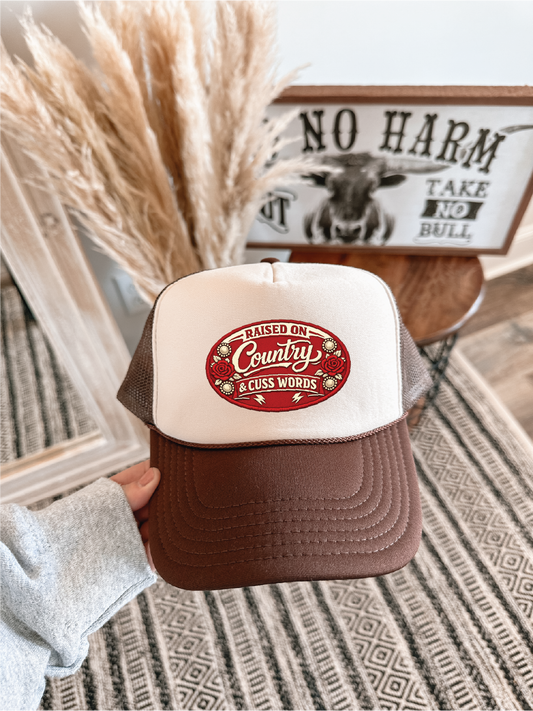 Raised on Country and Cuss Words DTF Printed Brown and Tan Trucker Hat